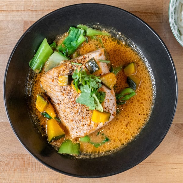 Plum Vietnamese Restaurant's salmon in a rich broth with bok choy, squash, and cilantro.